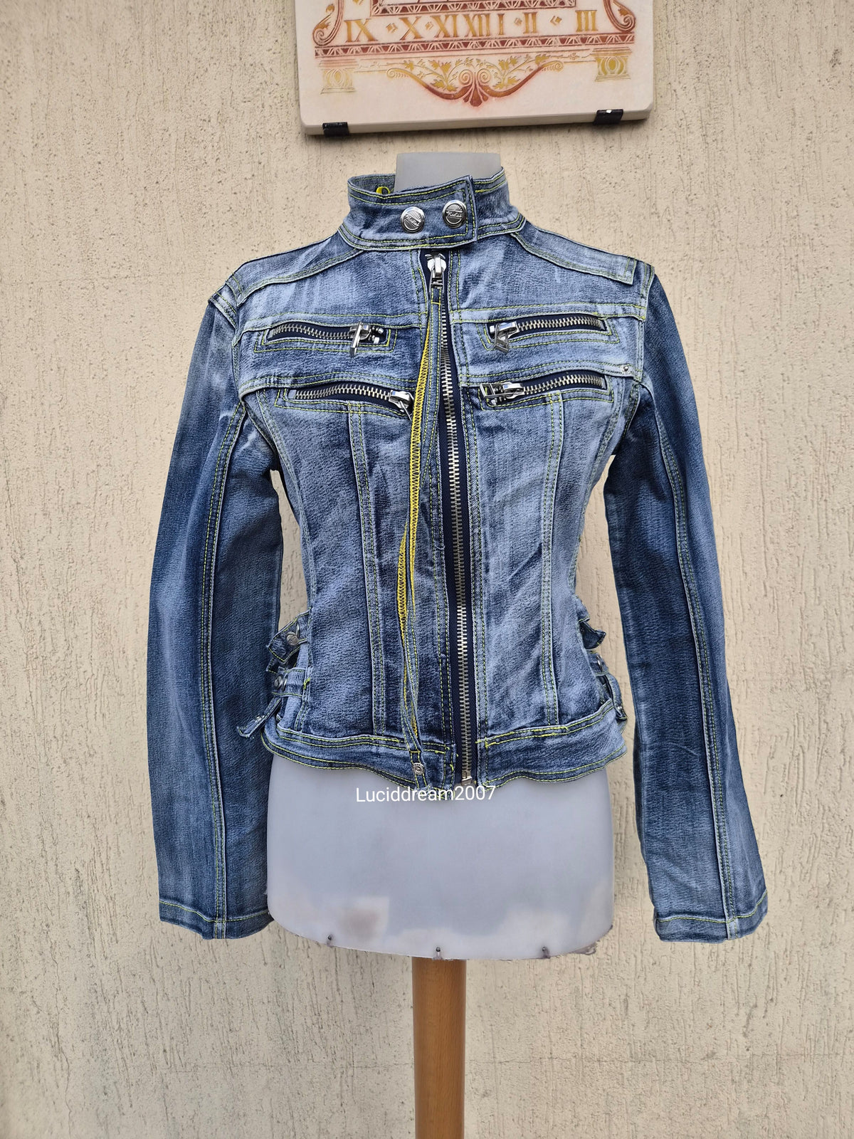 Denim jacket with zip and strap details