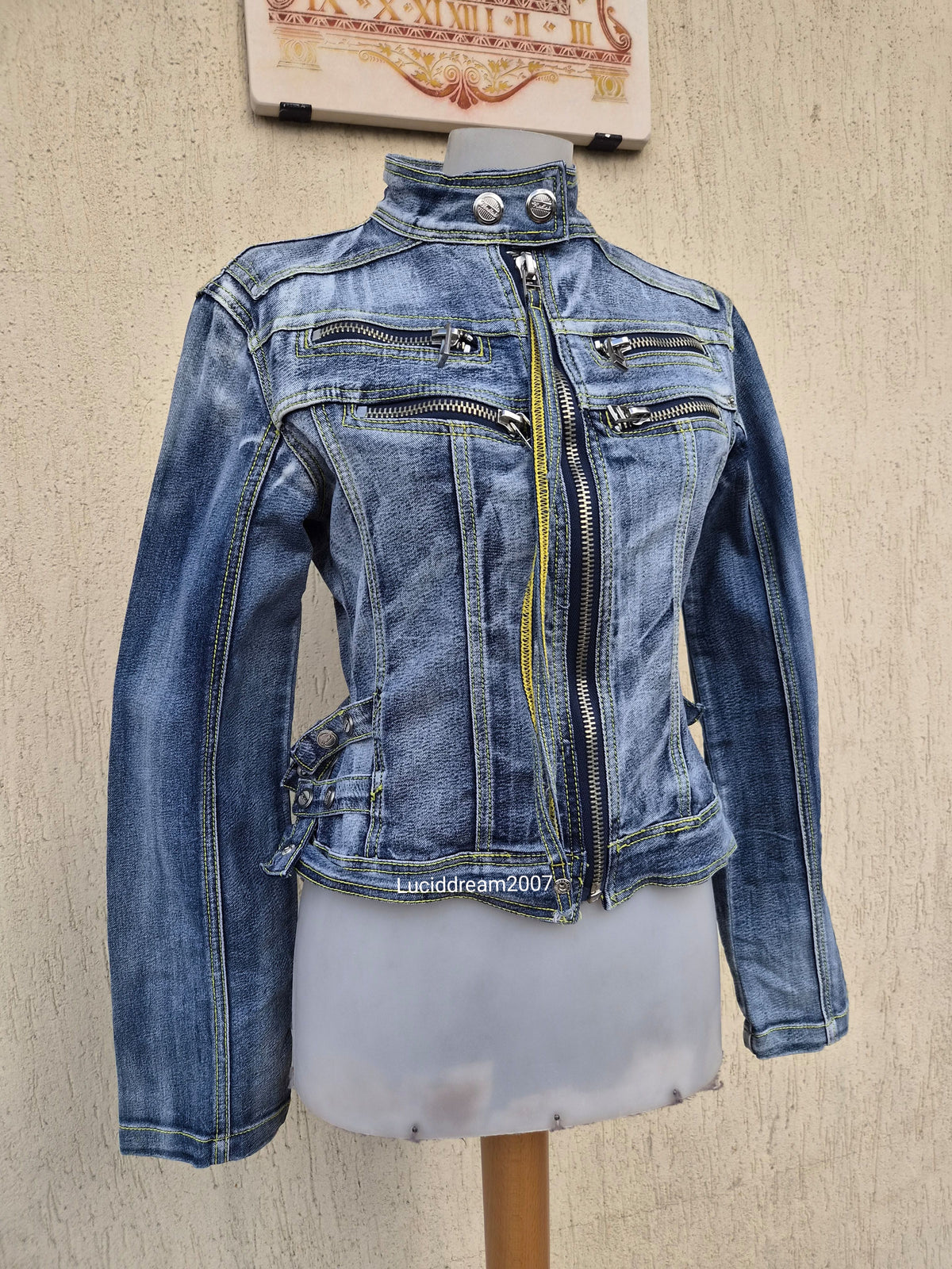 Denim jacket with zip and strap details