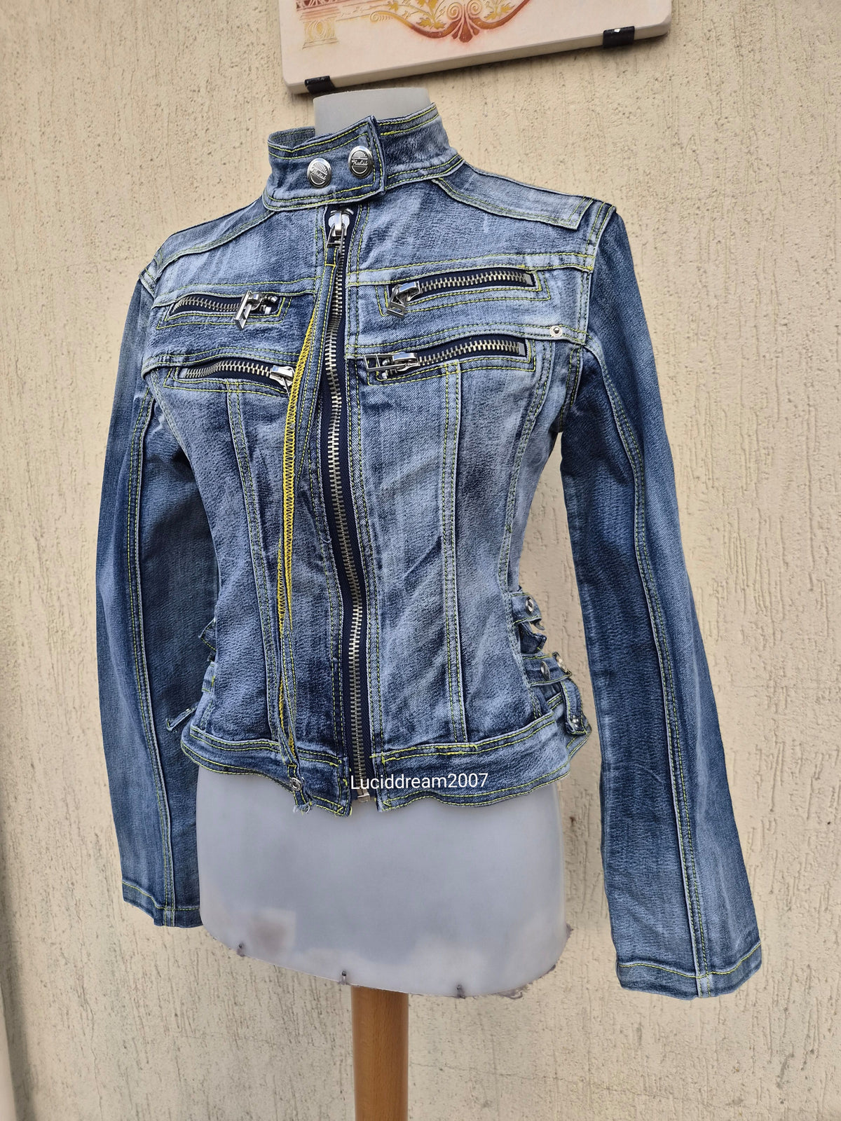 Denim jacket with zip and strap details