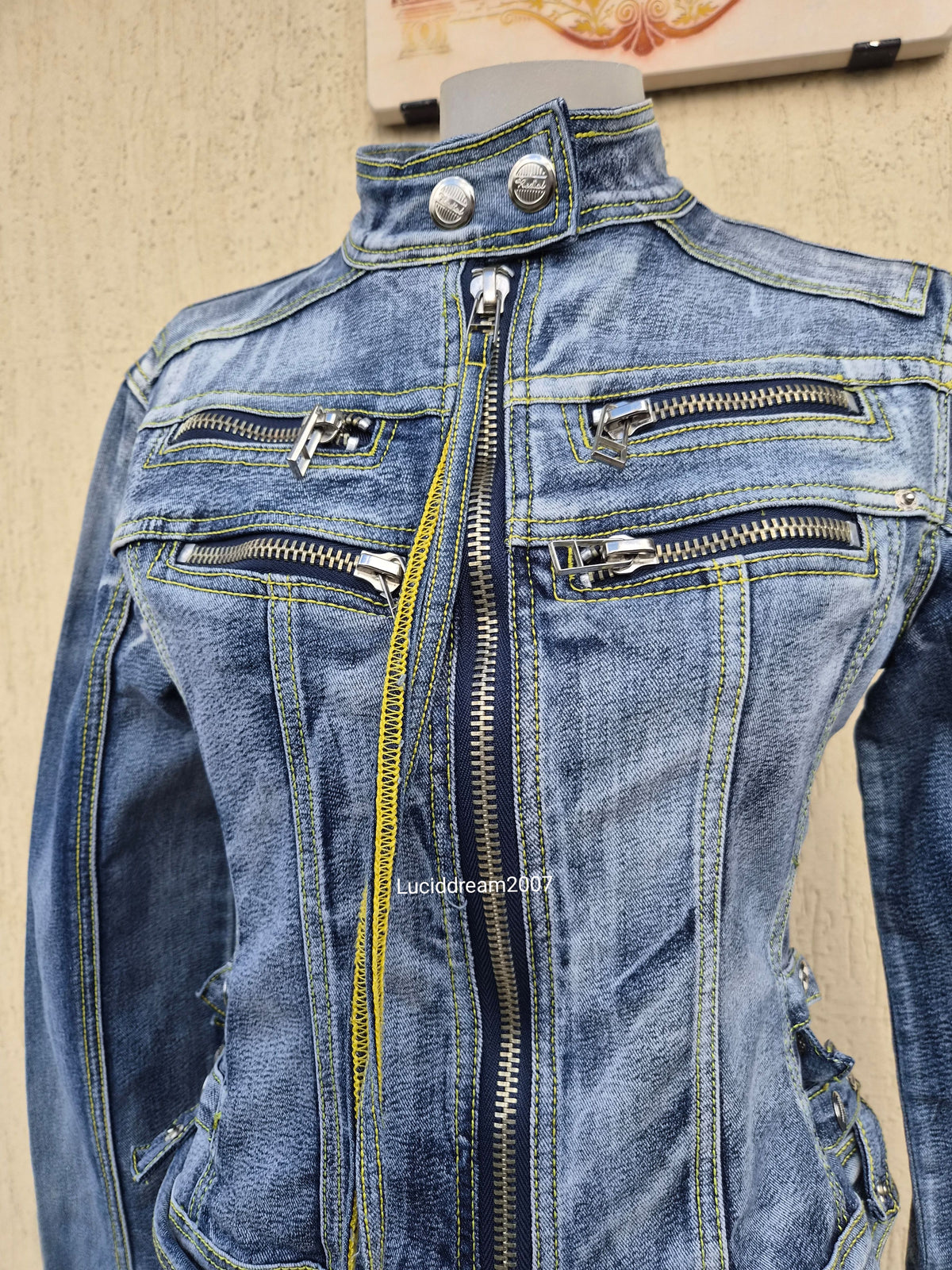 Denim jacket with zip and strap details
