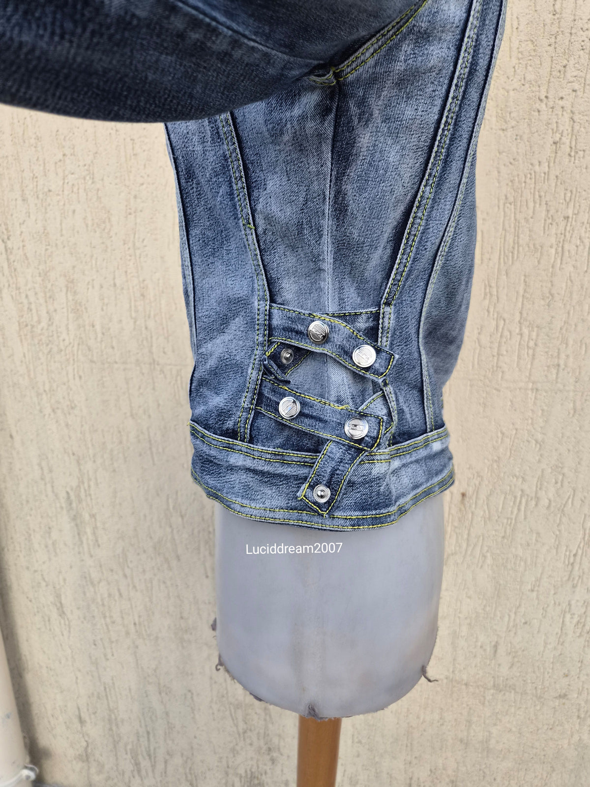 Denim jacket with zip and strap details