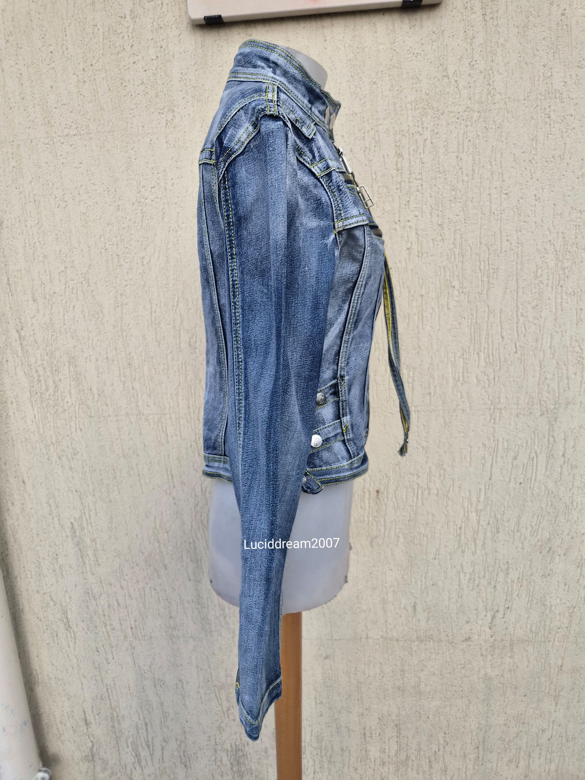 Denim jacket with zip and strap details