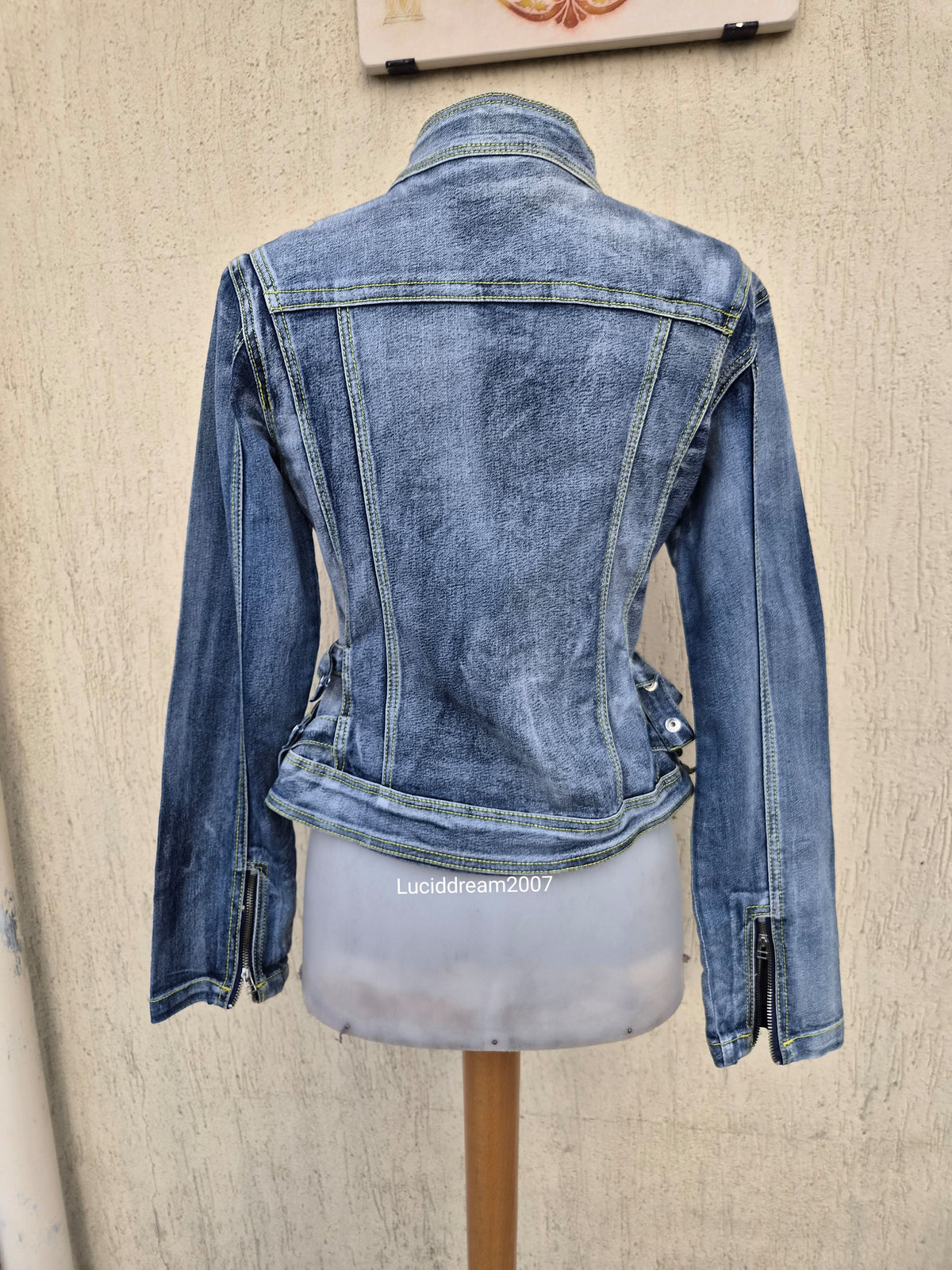 Denim jacket with zip and strap details
