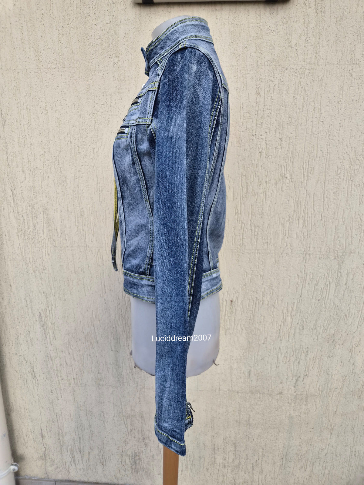 Denim jacket with zip and strap details