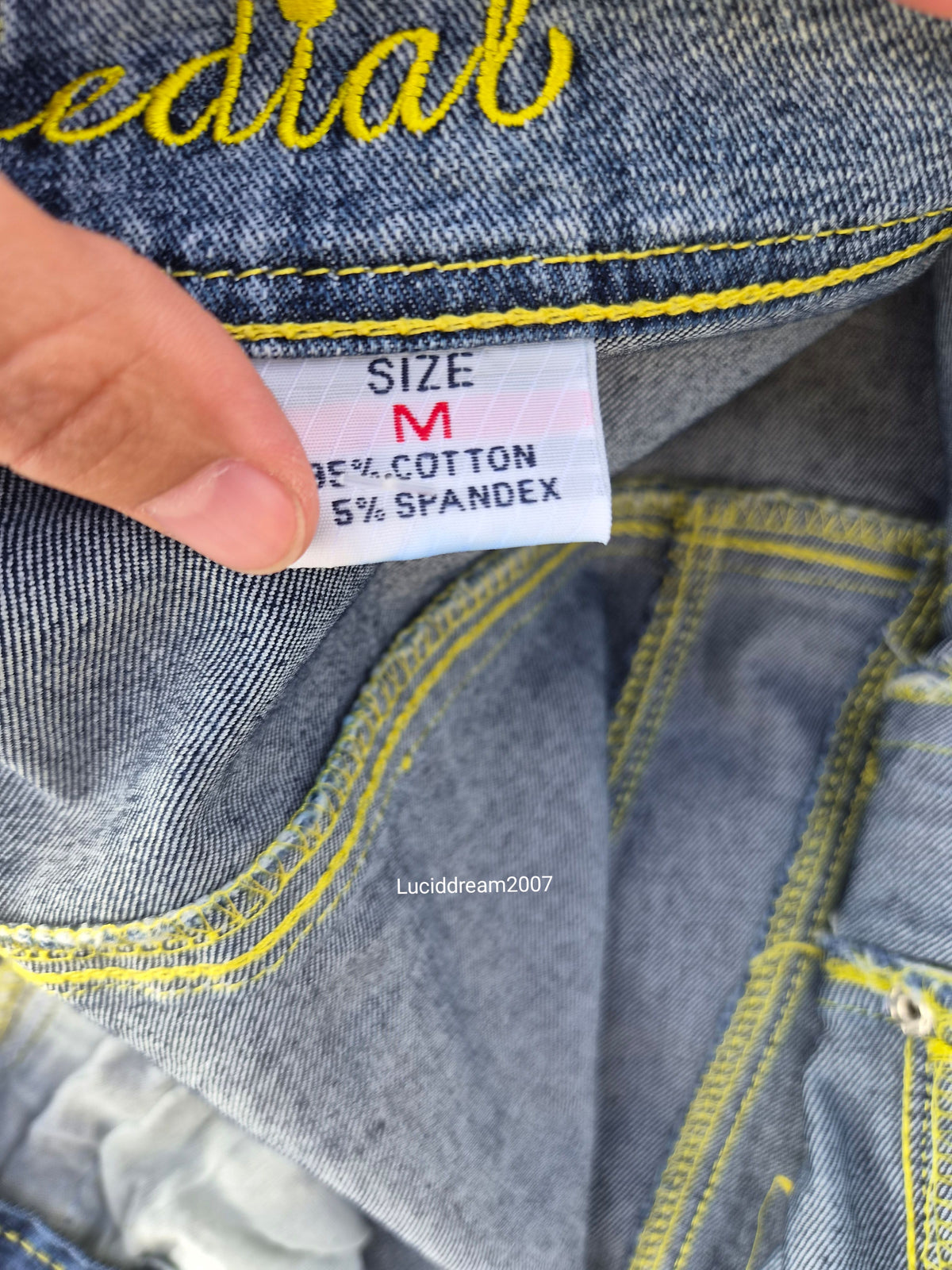 Denim jacket with zip and strap details