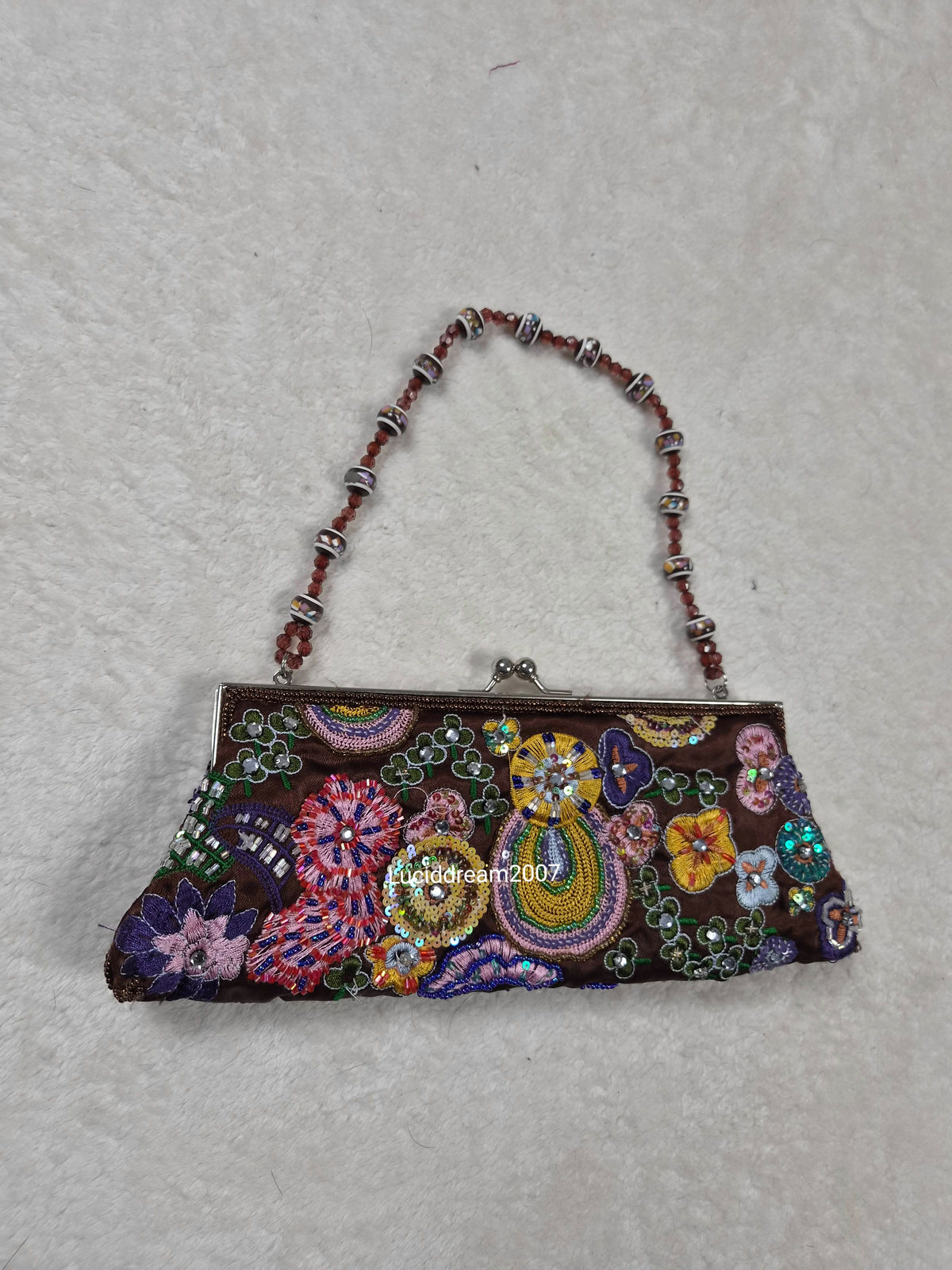 Small black bag embroidered with beads and sequins