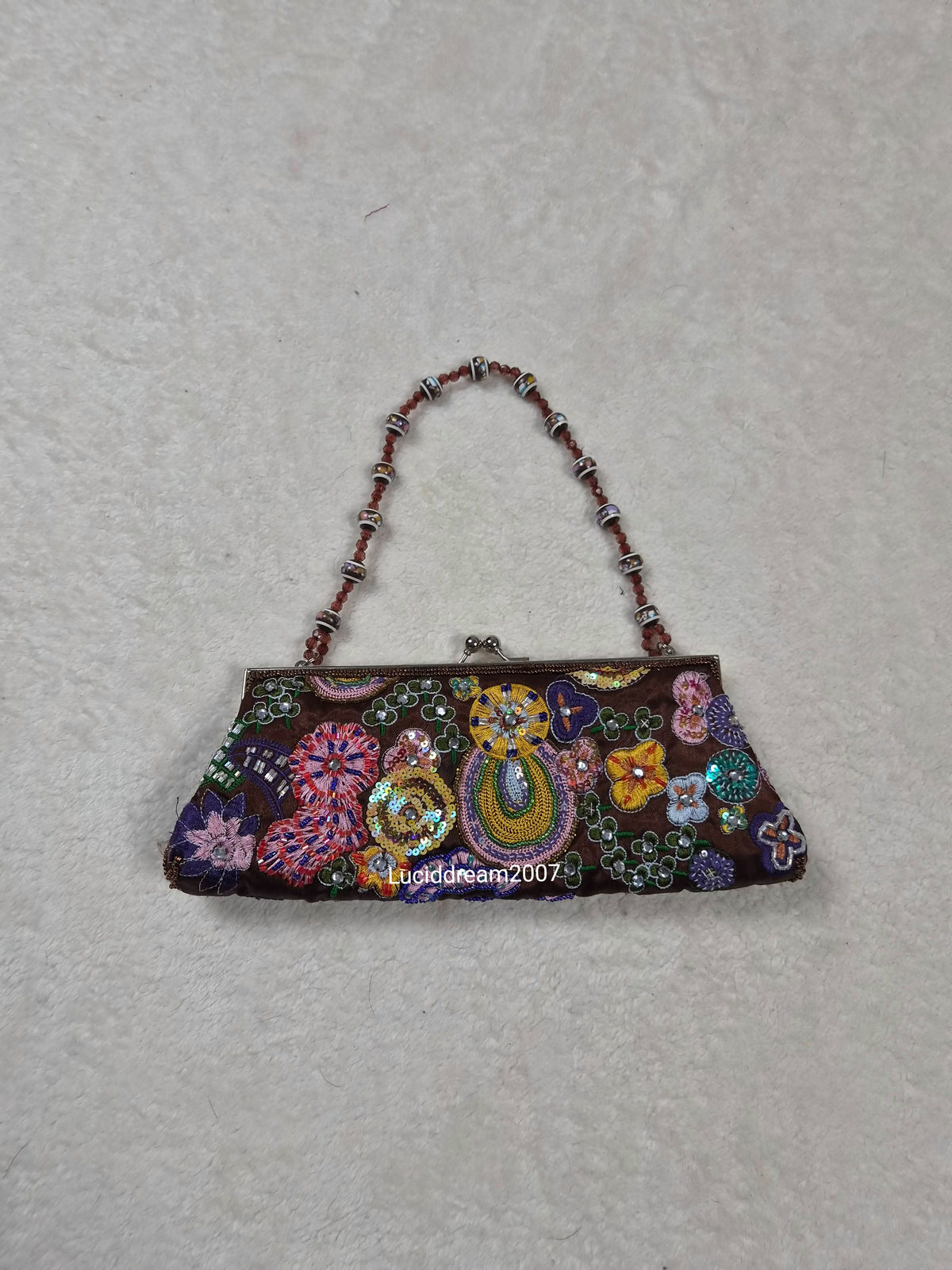 Small black bag embroidered with beads and sequins