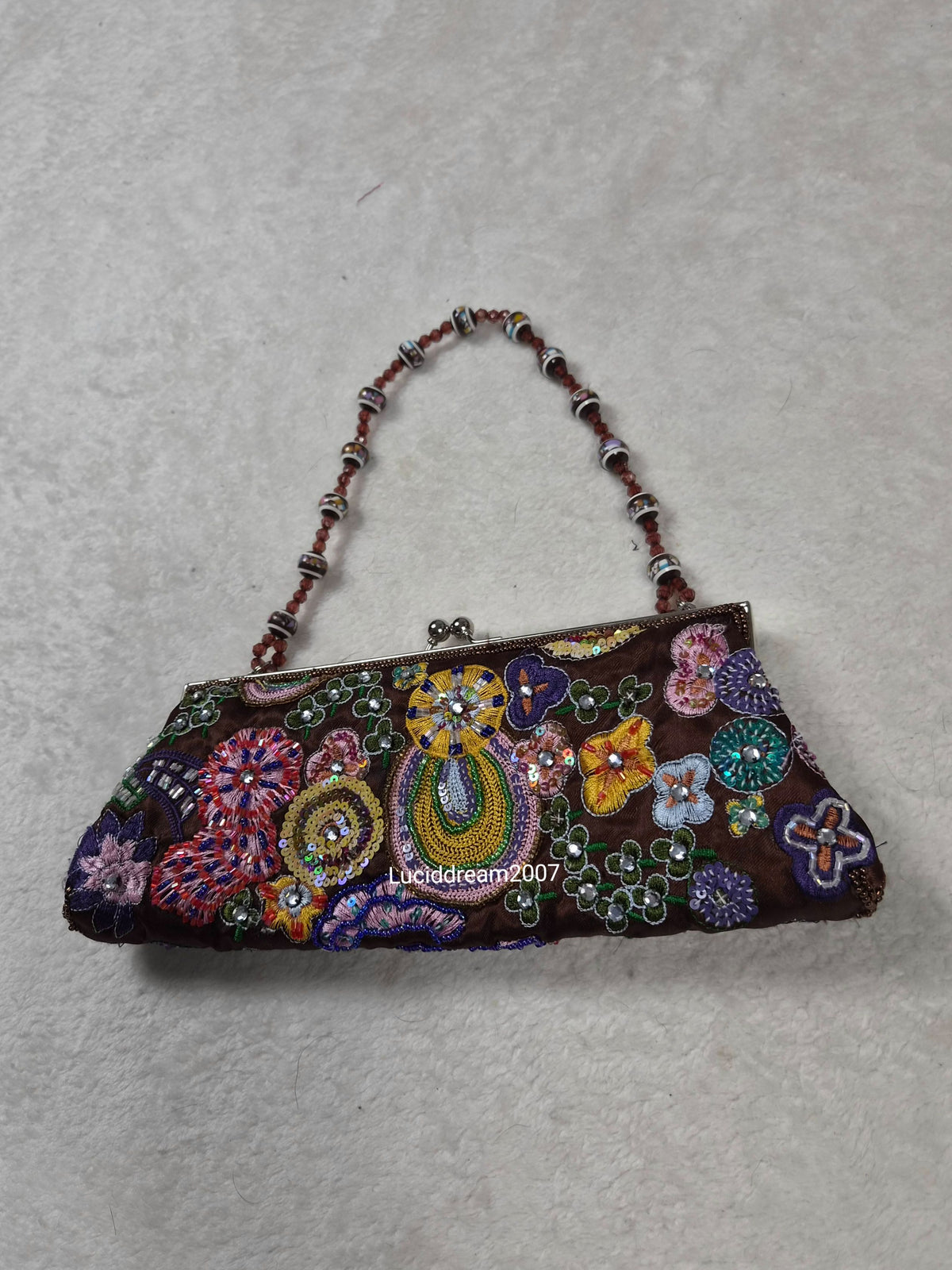 Small black bag embroidered with beads and sequins