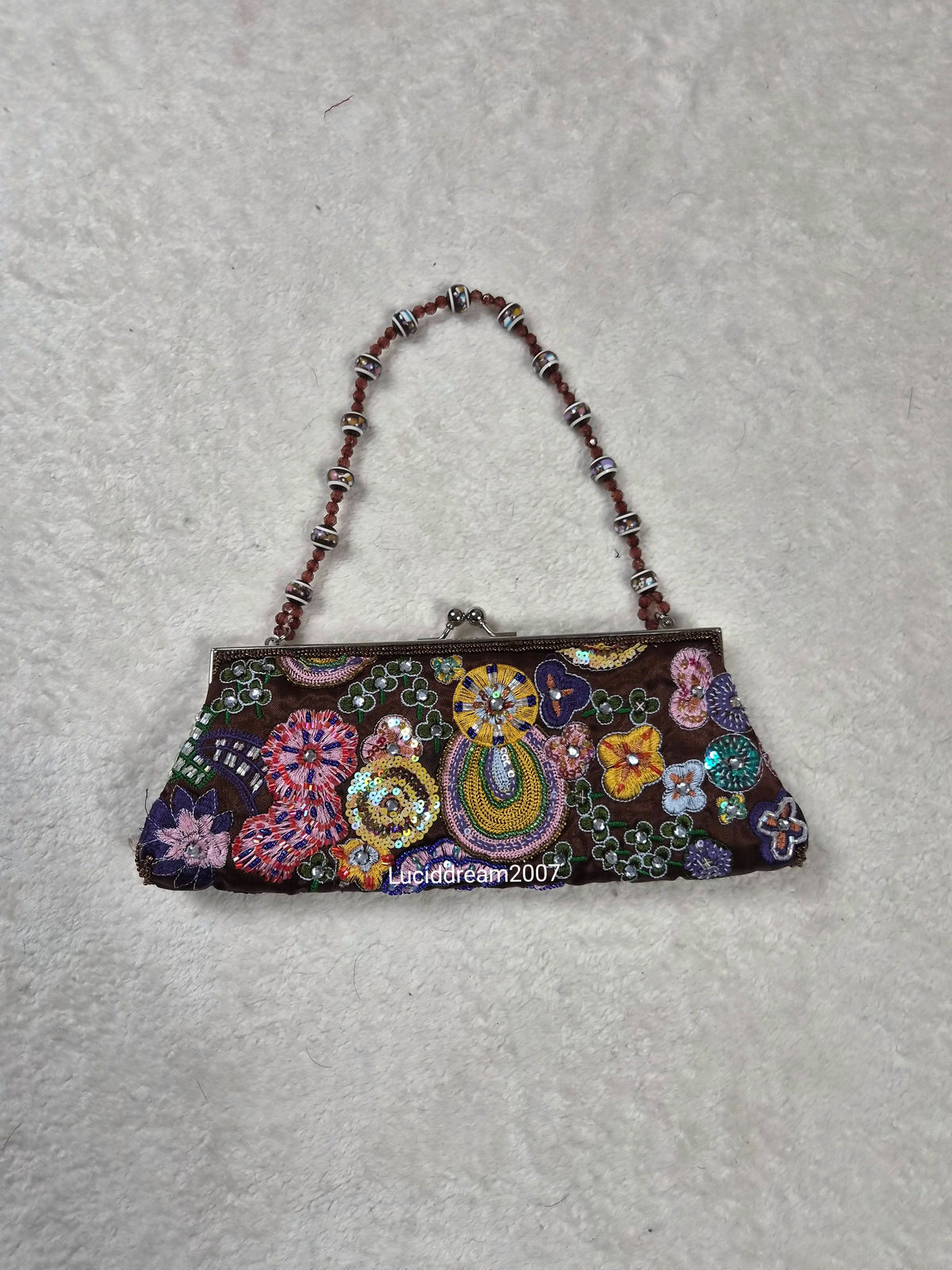 Small black bag embroidered with beads and sequins